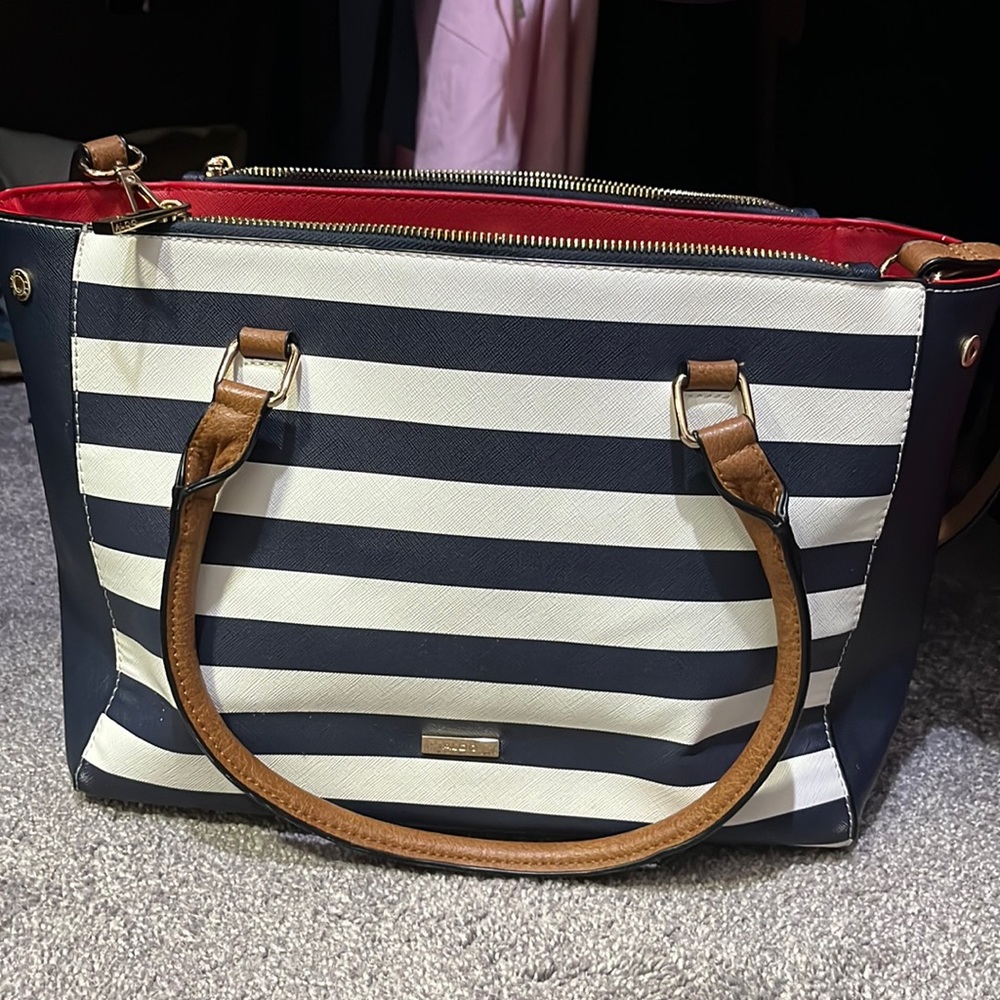 Blue, white, and red Aldo purse with brown leather straps
